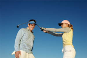 woman-hitting-man-golf-club