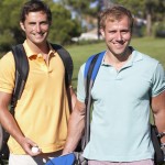 Two Men Enjoying Game Of Golf