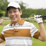 Portrait of a mature golf player smiling and looking at camera